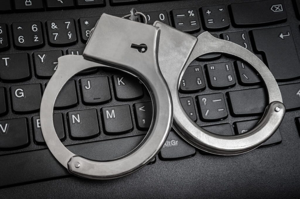 Handcuffs on keyboard (Courtesy of andriano_cz)