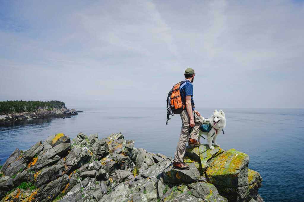 Man hiking with his dog in New Brunswick (Courtesy Cavan Images)