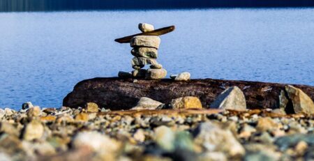 Inukshuk on rocky shore (Courtesy of Paul)