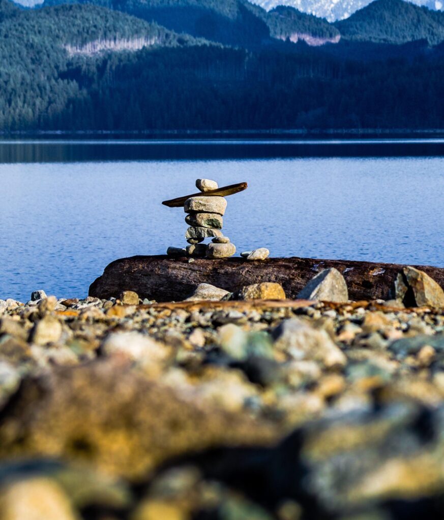 Inukshuk on rocky shore (Courtesy of Paul)