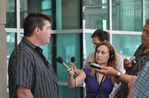 Darcy Allen answering questions at Calgary courthouse July 2012