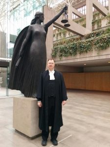Justice Centre president John Carpay with statue of Lady Justice, the Roman goddess Justitia (the Greek goddess Themis), outside the B.C. Court of Appeal, February 5, 2016.