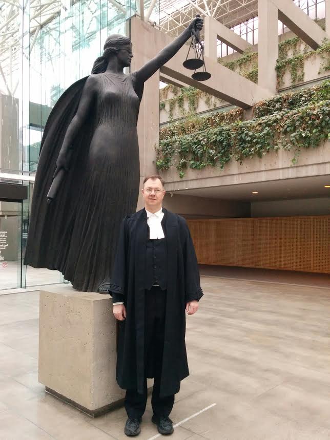 Justice Centre president John Carpay with statue of Lady Justice, the Roman goddess Justitia (the Greek goddess Themis), outside the B.C. Court of Appeal, February 5, 2016.