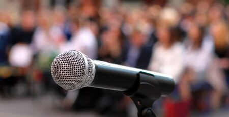 Mic at meeting/Adobe Stock