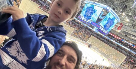 Photo Credit: Evan Blackman at a hockey game with his son Damian