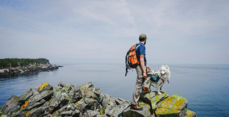 Man hiking with his dog in New Brunswick (Courtesy Cavan Images)