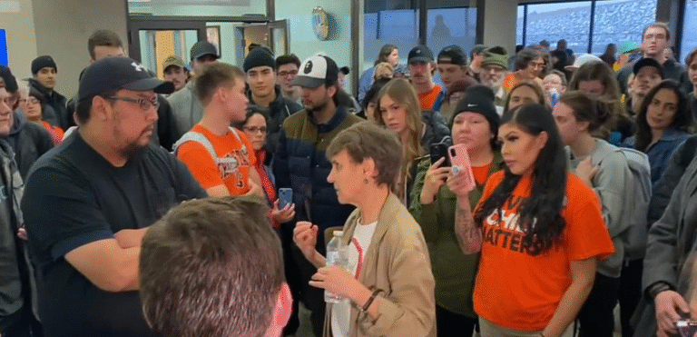 Dr. Widdowson speaks with protesters at the University of Lethbridge prior to the escalation of tensions surrounding her cancelled event (Courtesy of Global News)